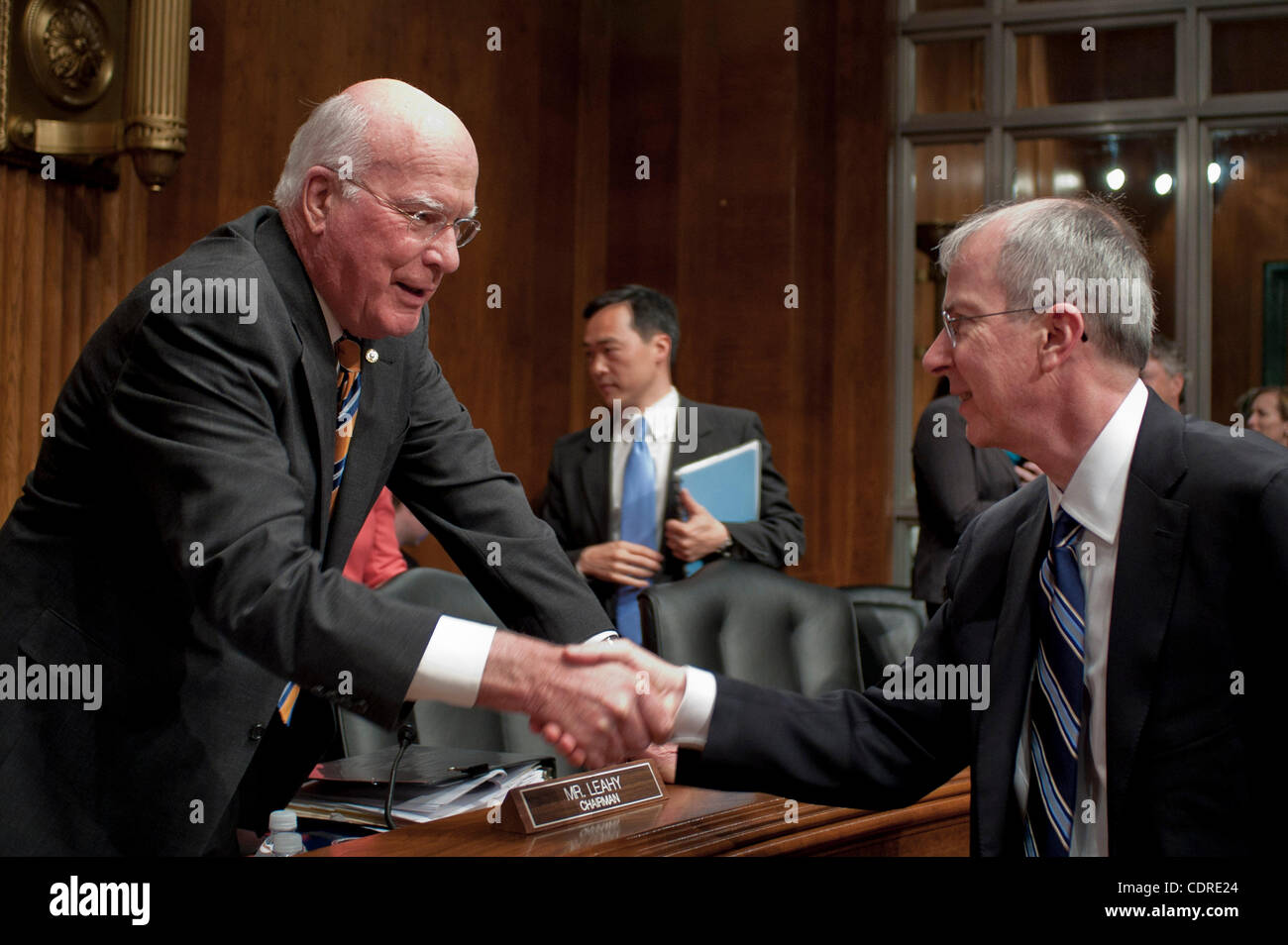 May 10, 2011 - Washington, District of Columbia, U.S. - GUY ''BUD'' TRIBBLE, vice president of software technology at Apple, Inc., is greeted by Senator PATRICK LEAHY (D- VT) before testifying before a Senate Privacy, Technology and the Law Subcommittee hearing on ''Protecting Mobile Privacy'' on Ca Stock Photo