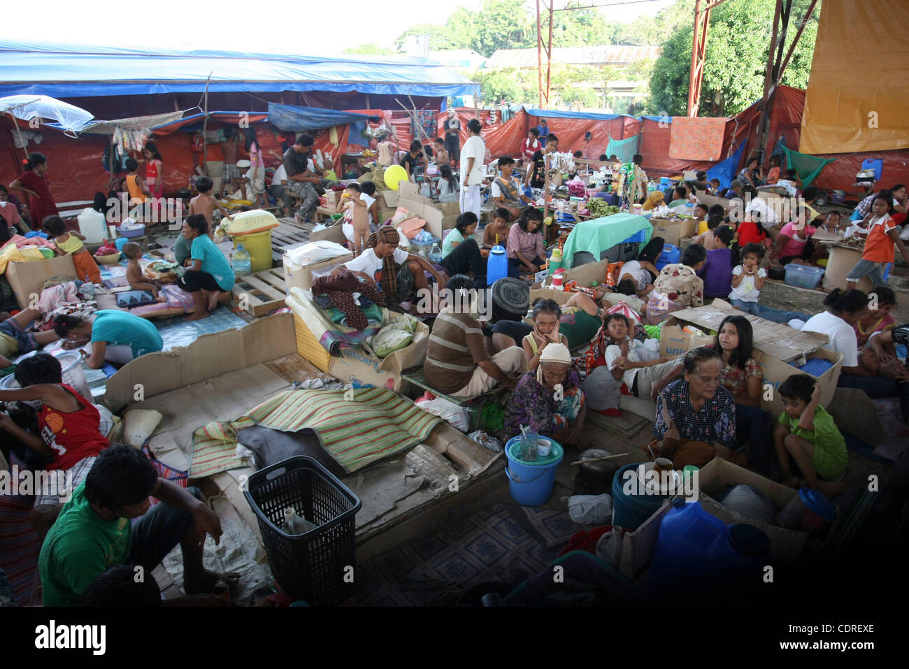 June 20, 2011 - Cotabato, Philippines - Filipino residents displaced by widespread flash floods are seen at the evacuation center in the southern city of Cotabato in the southern Philippines. More than a half million people were displaced by the floods. The military said Tuesday that flashfloods in  Stock Photo