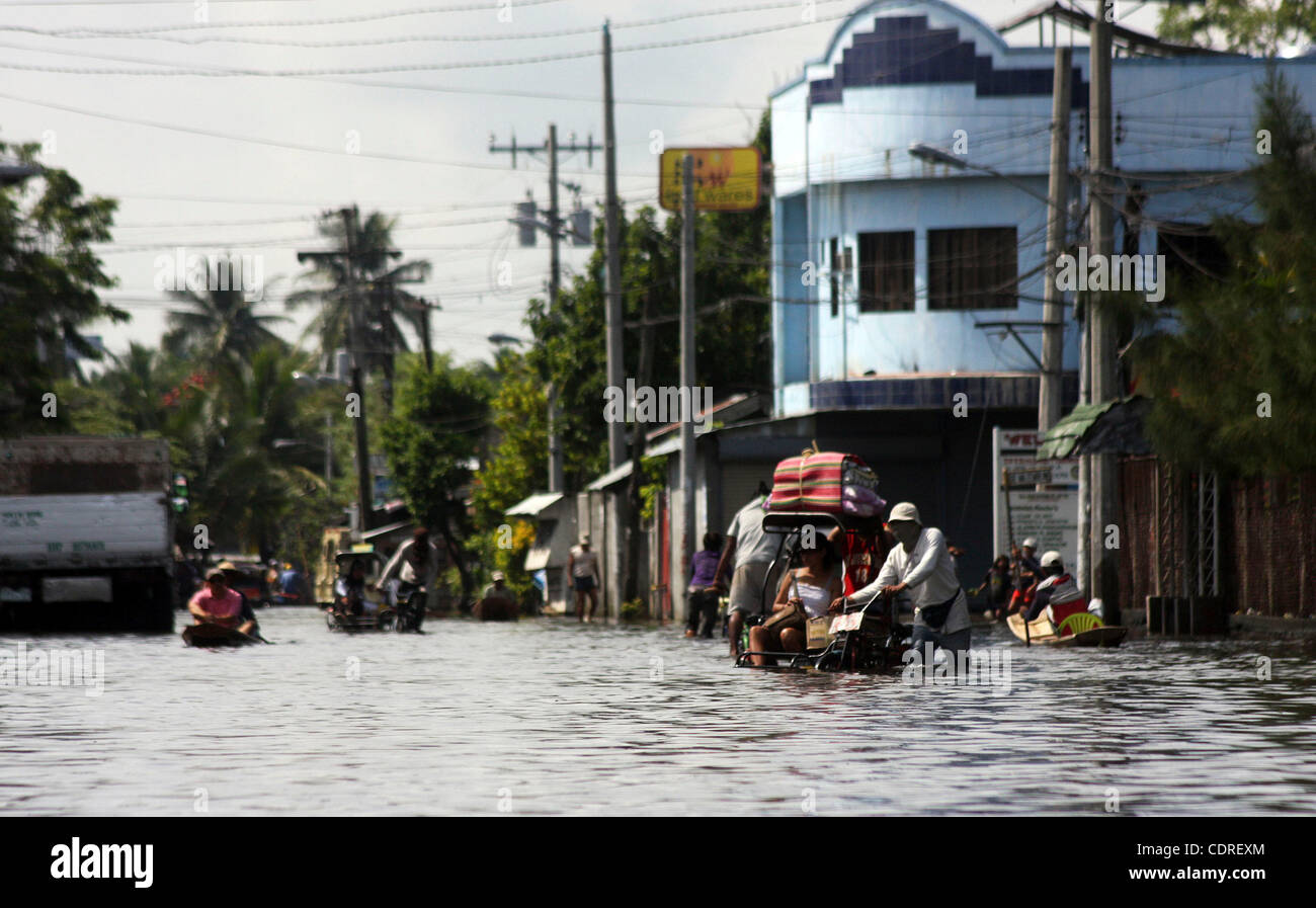 June 20, 2011 - Cotabato, Philippines - Filipino residents displaced by widespread flash floods are seen in the southern city of Cotabato in the southern Philippines. More than a half million people were displaced by the floods. The military said Tuesday that flashfloods in the region were caused by Stock Photo