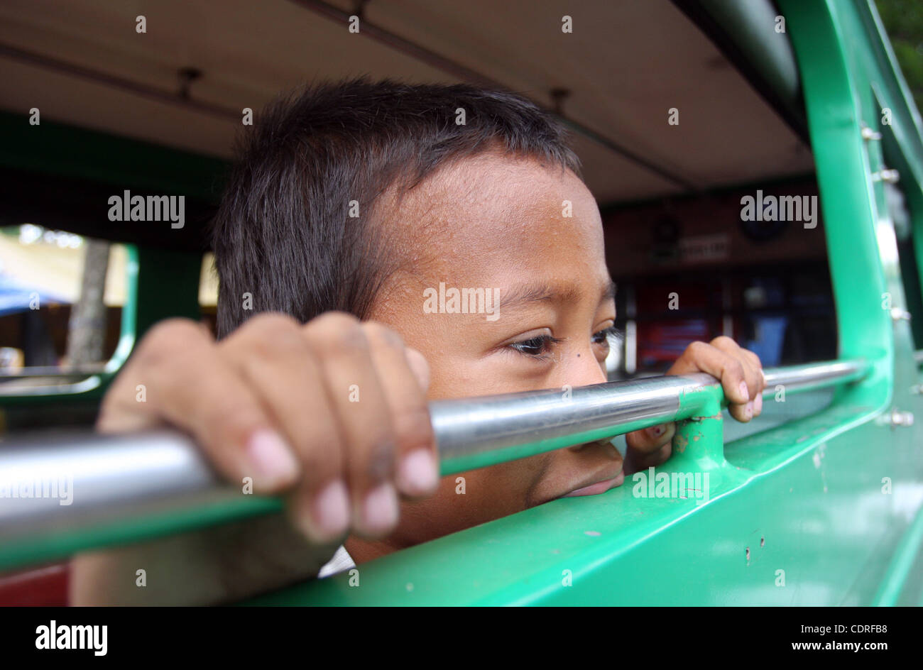 Jul 1, 2011 - Sultan Kudarat, Philippines - A Filipino kid displaced by widespread flash floods is seen in the southern town of Sultan Kudarat in the southern Philippines, Friday. Flood waters in the region caused by the clogging of tons of water lilies subsided but in the city of Davao, flash flood Stock Photo