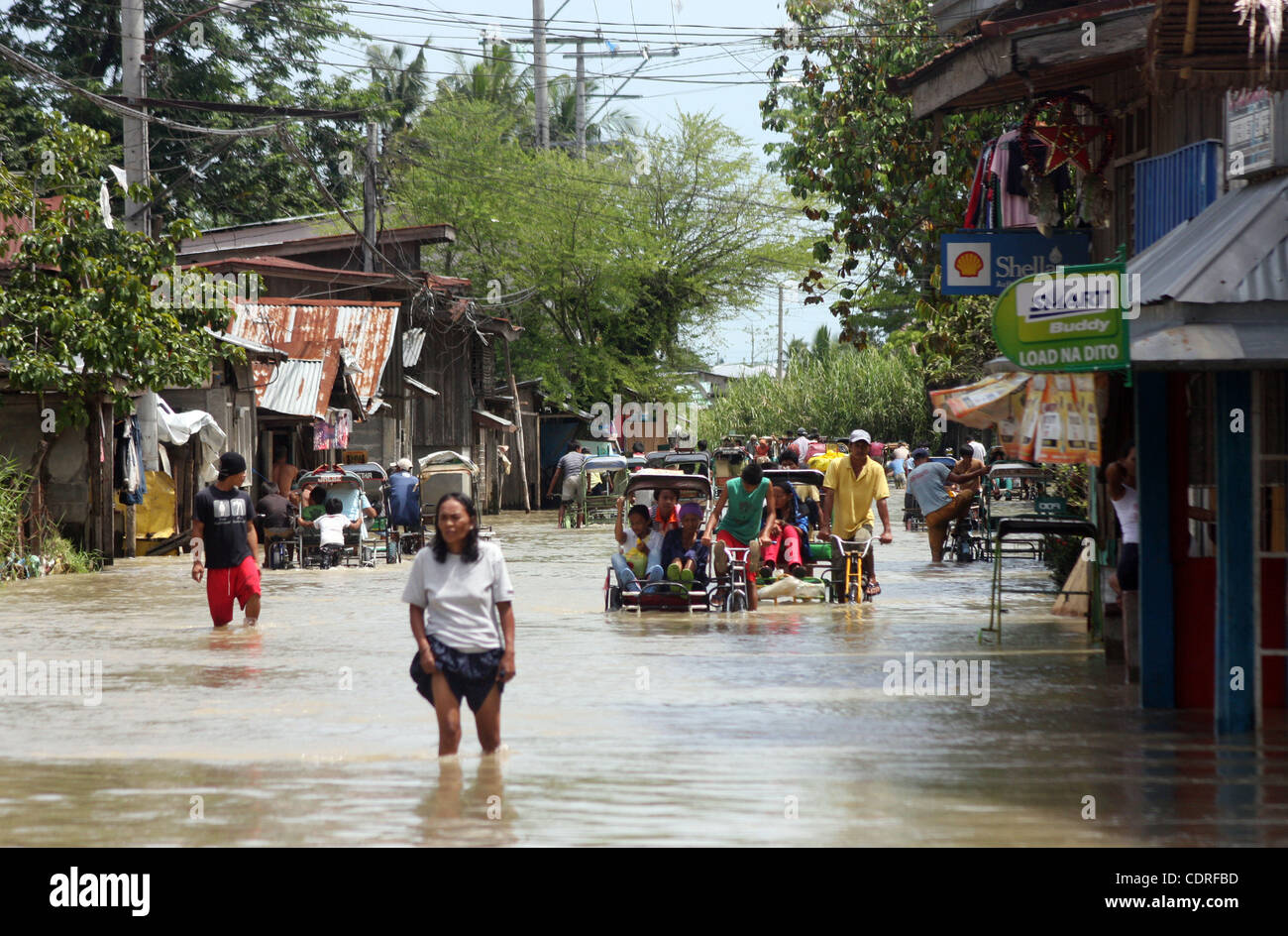 Jul 1, 2011 - Sultan Kudarat, Philippines - Filipino residents displaced by widespread flash floods are seen in the southern town of Sultan Kudarat in the Philippines, Friday. Flood waters in the region caused by the clogging of tons of water lilies subsided but in the city of Davao, flash floods on Stock Photo