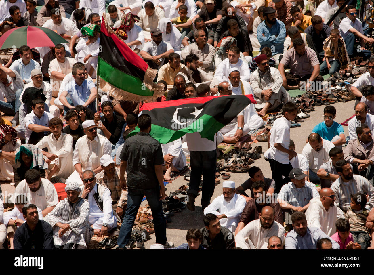 May 20, 2011 - Benghazi, Libya - People hold flags during the midday ...