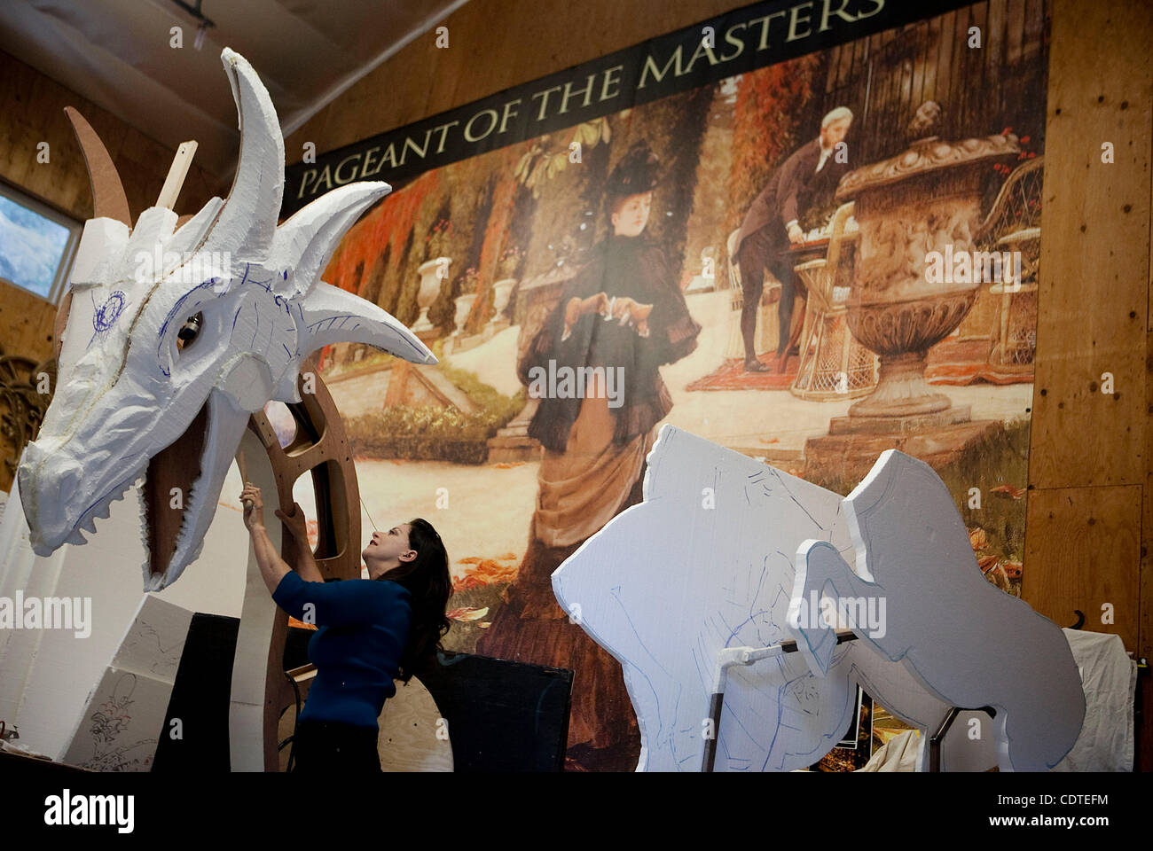 Jean Ashton cuts and shapes a large styrofoam dragon head in the Pageant of  the Masters workshop that will be used in live performances during this  year's event themed "Only Make Believe."