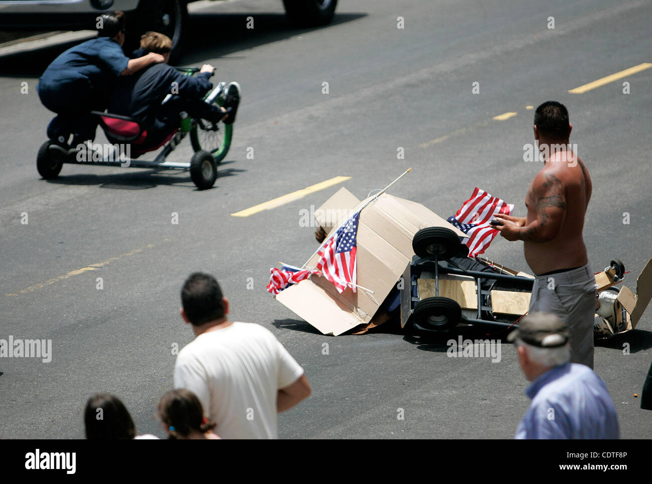 during the 6th annual Unofficial San Clemente Office Chair Races on Avenida Rosa.  Originally started with real office chairs, contest organizers now admit their definition of an office chair is 'loosely defined.'  The annual Fourth of July event attracts a couple of hundred onlookers on average. Stock Photo