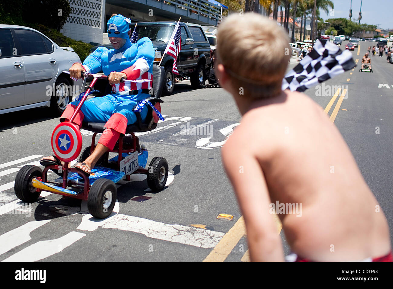 during the 6th annual Unofficial San Clemente Office Chair Races on Avenida Rosa.  Originally started with real office chairs, contest organizers now admit their definition of an office chair is 'loosely defined.'  The annual Fourth of July event attracts a couple of hundred onlookers on average. Stock Photo