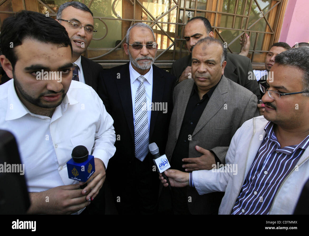 Mohammed Badie, the head of Egypt's Muslim Brotherhood speaks to the press outside a polling station Cairo after casting his vote on March 19, 2011 as voters got their first taste of democracy in a referendum to a package of constitutional changes after president Hosni Mubarak was forced to relinqui Stock Photo