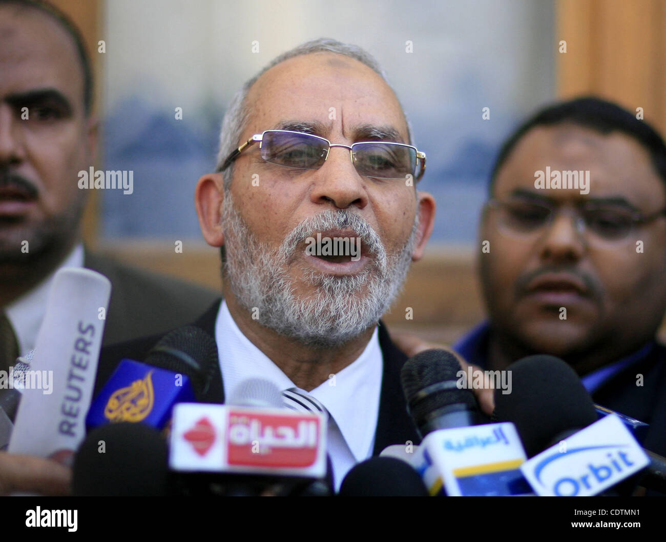 Mohammed Badie, the head of Egypt's Muslim Brotherhood speaks to the press outside a polling station Cairo after casting his vote on March 19, 2011 as voters got their first taste of democracy in a referendum to a package of constitutional changes after president Hosni Mubarak was forced to relinqui Stock Photo