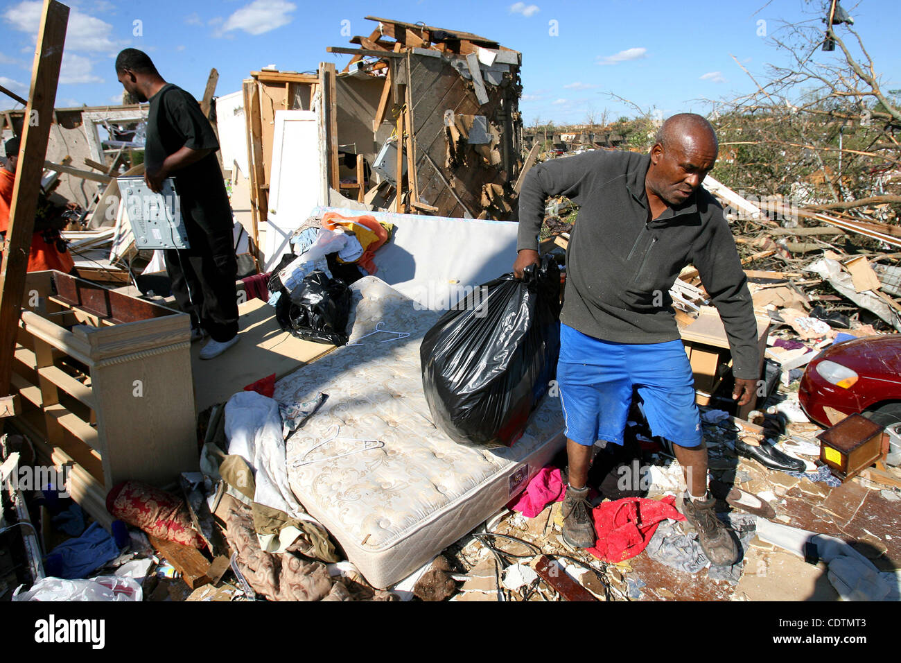 Apr 28, 2011 - Tuscaloosa, Alabama, U.S. - People pull items from their  tornado ravaged home in Tuscaloosa, Alabama. Over 100 have been confirmed dead in the state after deadly tornados destroyed homes and businesses yesterday. (Credit Image: &#169; Dan Anderson/ZUMAPRESS.com) Stock Photo