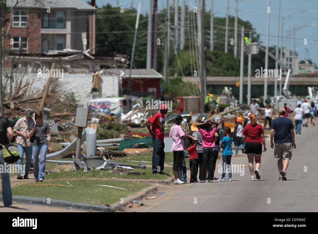 Apr 29, 2011 - Tuscaloosa , Alabama, USA - People walk through the streets of Tuscaloosa, Alabama to see the damage left behind by a string of powerful tornados that hit the area on April 27, 2011 causing massive devastation and killing nearly three hundred in the Southern region of the United State Stock Photo