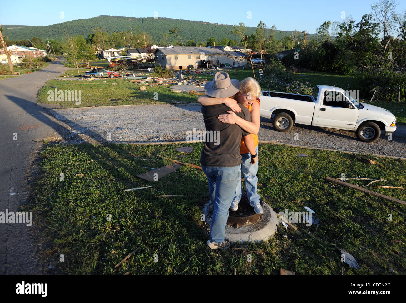 April 29, 2011 Trenton, U.S. Judy Bonine (R) hugs her son Kyle Adkins after