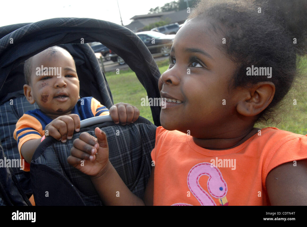 Khloe Matthews, 3, and Karter Matthews, 1, play with a hula hoop