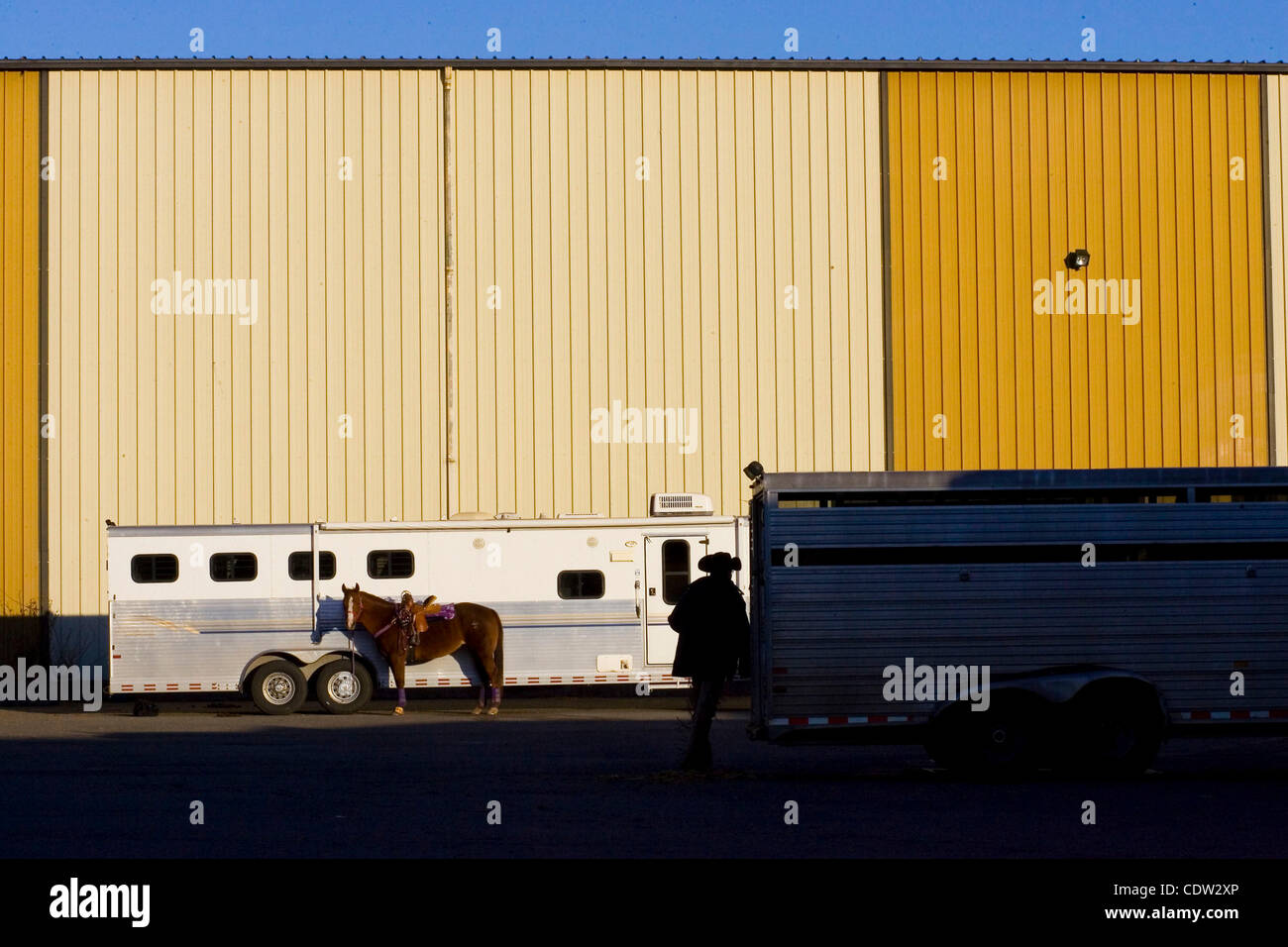 June 7, 2011 - Lynden, WA, U.S. - Mac unloads his trailer of gear and horses before a riding clinic in Lynden, WA. He has attended some of the most prestigious events of such nature for a better part of his adult life, yet continues to enjoy training and teaching eager, young riders. (Credit Image:  Stock Photo