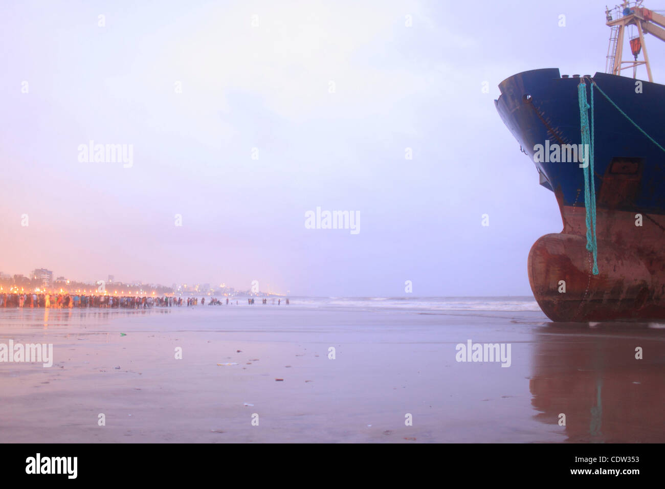 An unusual sight greeted the monsoon Revellers at the Juhu Chowpatty beach in Mumbai,India as the MV Wisdom,a merchant ship has been grounded since June 11 after it broke loose from the towing tug and it drifted ashore while it was being towed away to Alang shipyard to be broken down as scrap. Techn Stock Photo