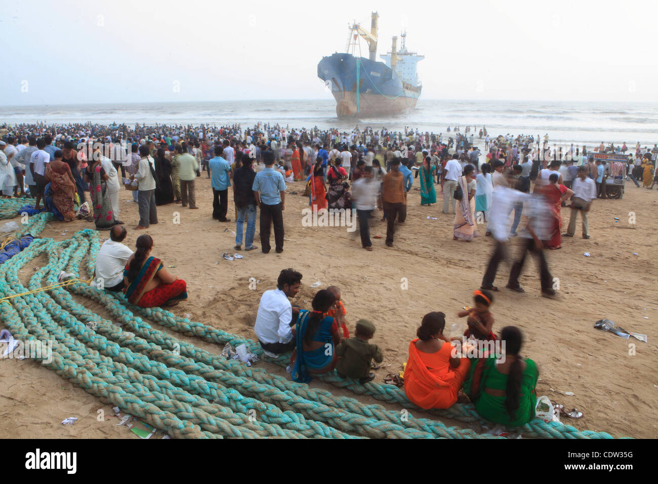 An unusual sight greeted the monsoon Revellers at the Juhu Chowpatty beach in Mumbai,India as the MV Wisdom,a merchant ship has been grounded since June 11 after it broke loose from the towing tug and it drifted ashore while it was being towed away to Alang shipyard to be broken down as scrap. Techn Stock Photo