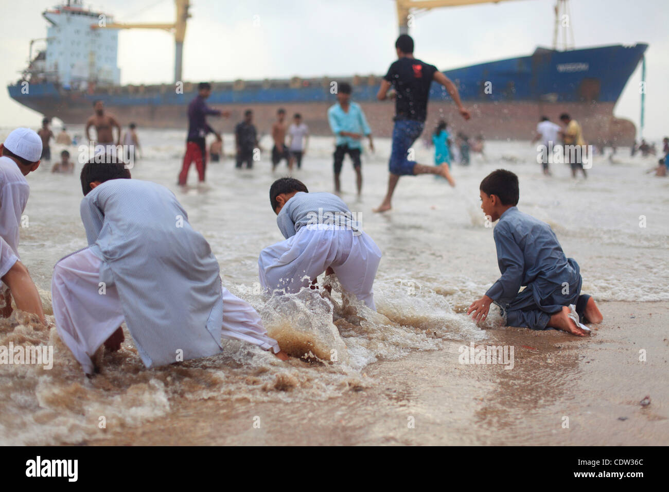 June 26, 2011 - Mumbai, India - An unusual sight greeted the monsoon revellers at the Juhu Chowpatty beach as the MV Wisdom, a merchant ship, has been grounded since June 11 after it broke loose from the towing tug and drifted ashore while it was being towed away to Alang shipyard to be broken down  Stock Photo