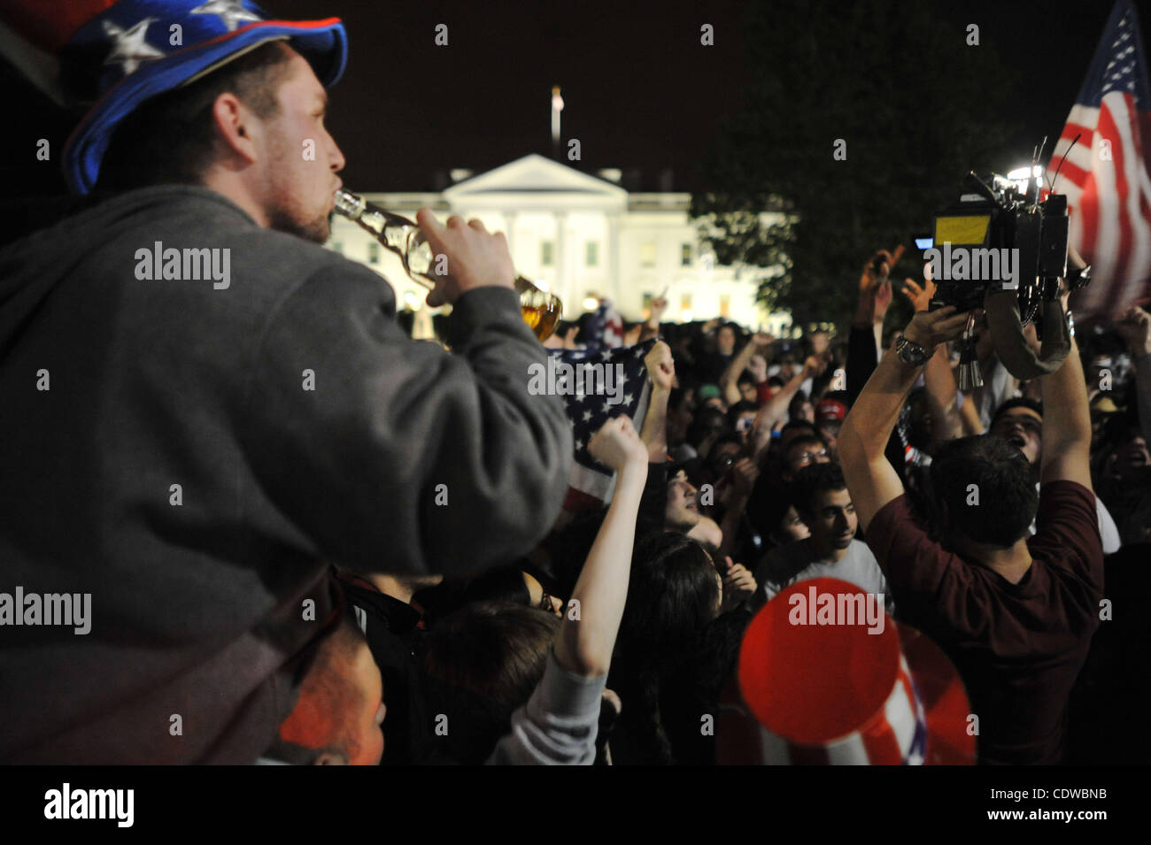 May 2, 2011 - Washington, District of Columbia, U.S. - The American stars and strips was being waved and worn by many of the thousands who gathered at the White House in celebration after U.S. President Barack Obama announced the death of Al-Qaeda front man Osama bin Laden. (Credit Image: © Vaughn W Stock Photo