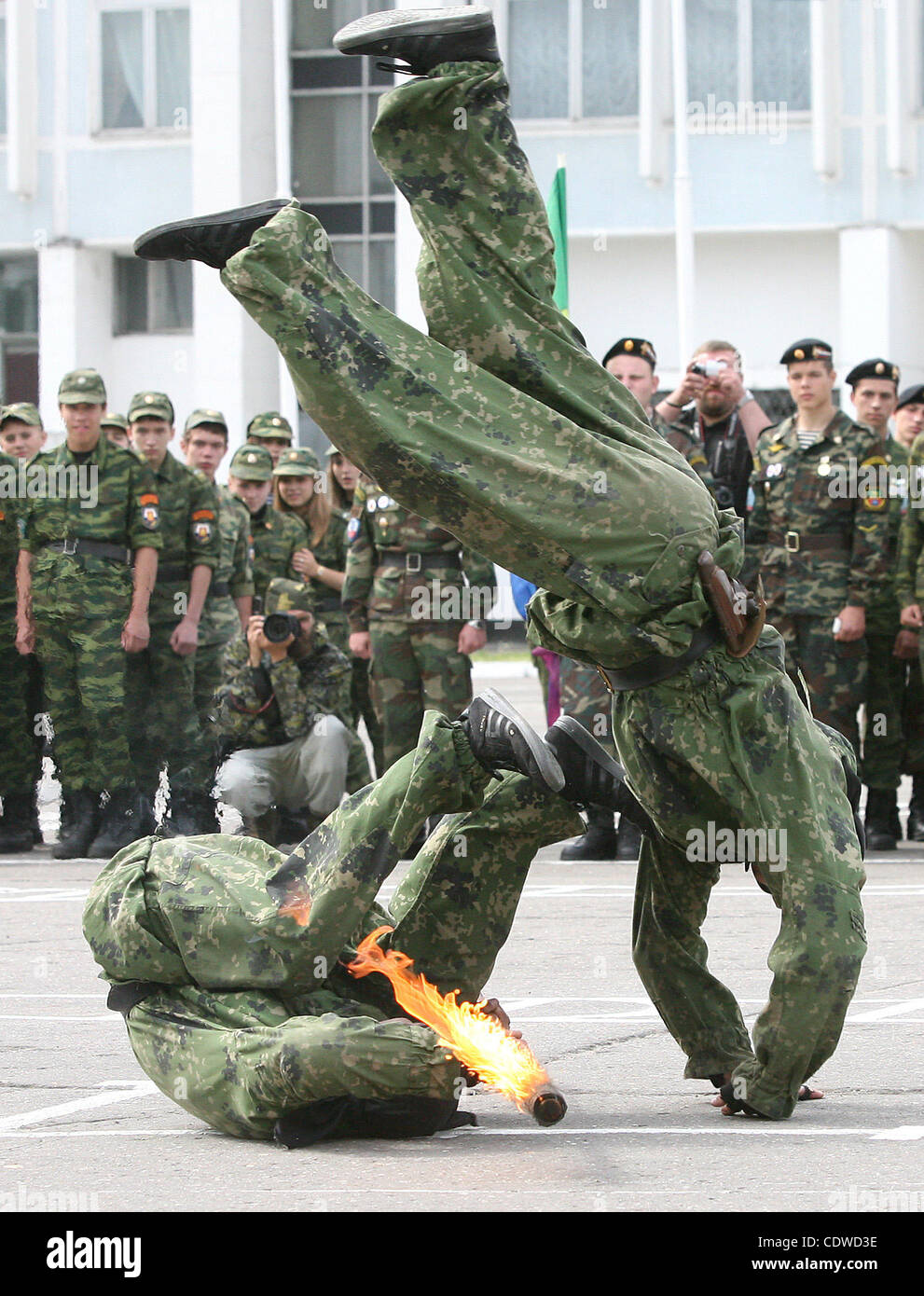 Russian teenagers are getting military skills during the summer training camp Zarnitsa for teenages organized by military-patriotic club.The event is taking place at the military base of 27th Rifle-infantry division near Moscow.Pictured: Spetsnaz unit soldiers demonstrate their skills to children. Stock Photo