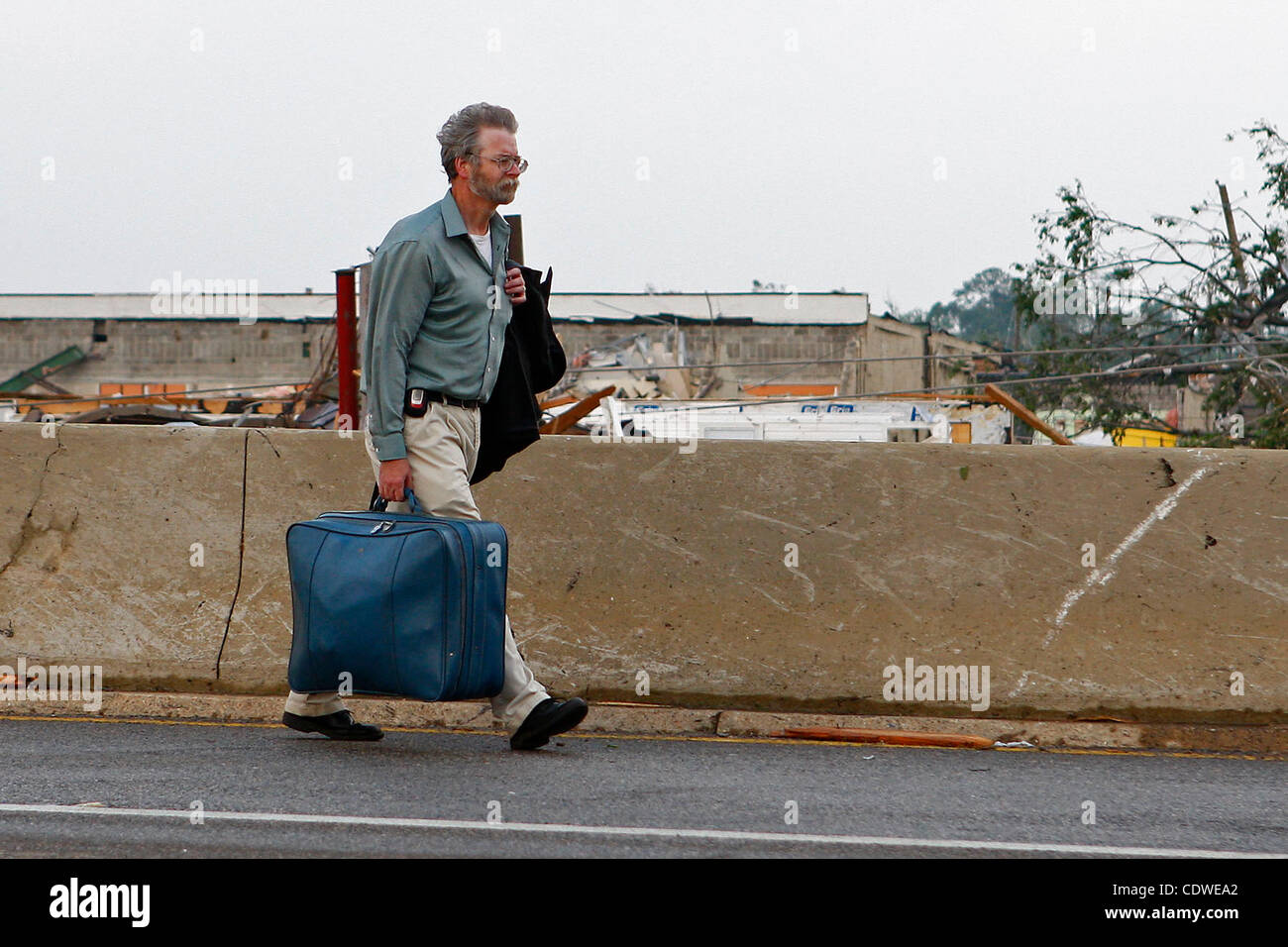 Apr. 28, 2011 - Tuscaloosa, Alabama, U.S. - A man walks away from his house that was destroyed by the tornado that ripped through Tuscaloosa, Al. (Credit Image: © Jason Clark/Southcreek Global/ZUMAPRESS.com) Stock Photo