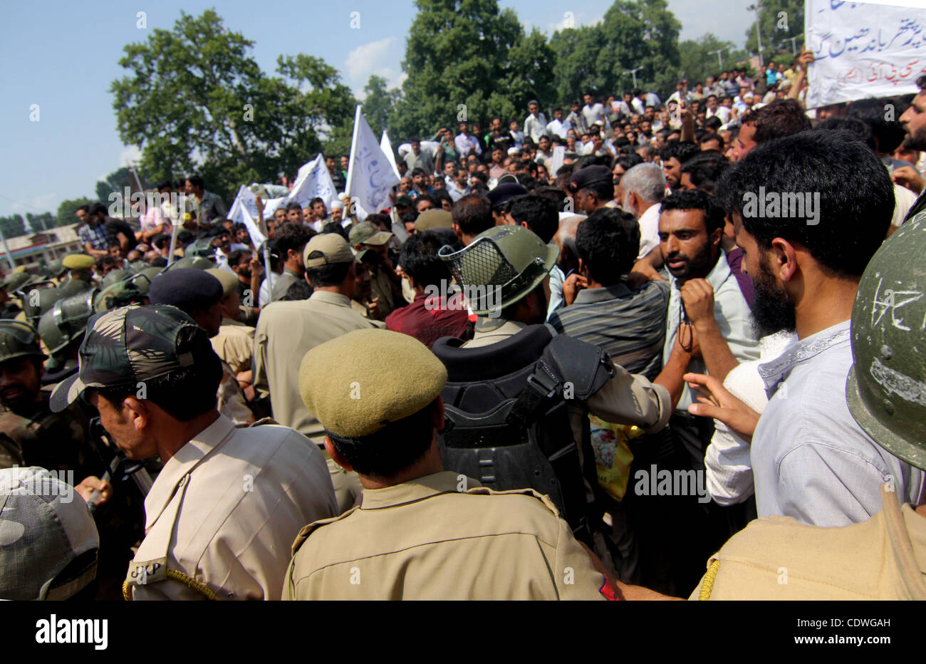 indian police try to stop mumbers of  Communist Party of India (Marxist)  during a protest in Srinagar, the summer capital of indian kashmir , on 20/7/2011, Communist Party of India (Marxist) today organized a protest march against rising inflation and rampant arrest of youths over anti national cha Stock Photo