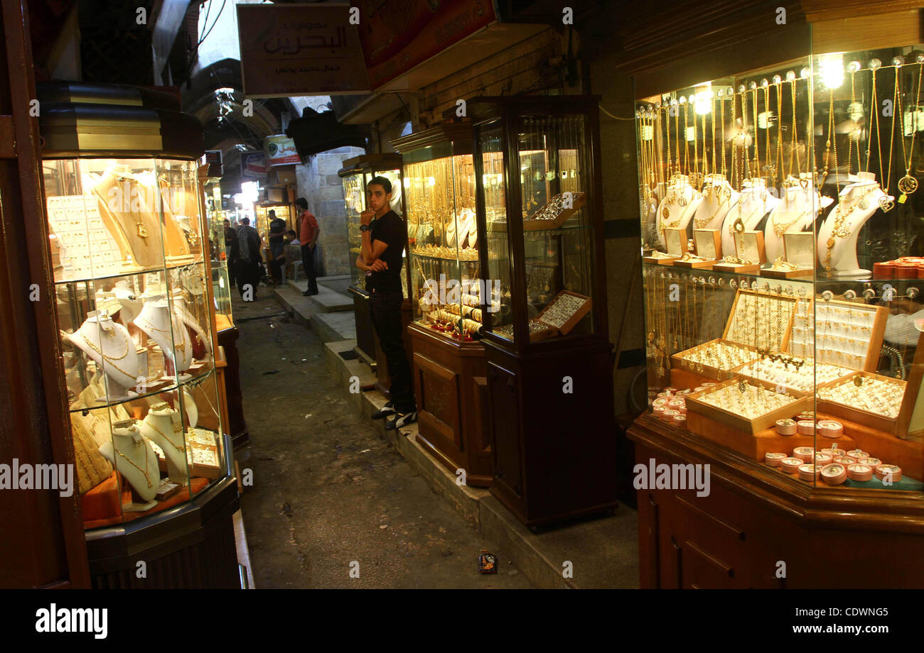 A Palestinian vendor stands infront of his jewellery store in Gaza city