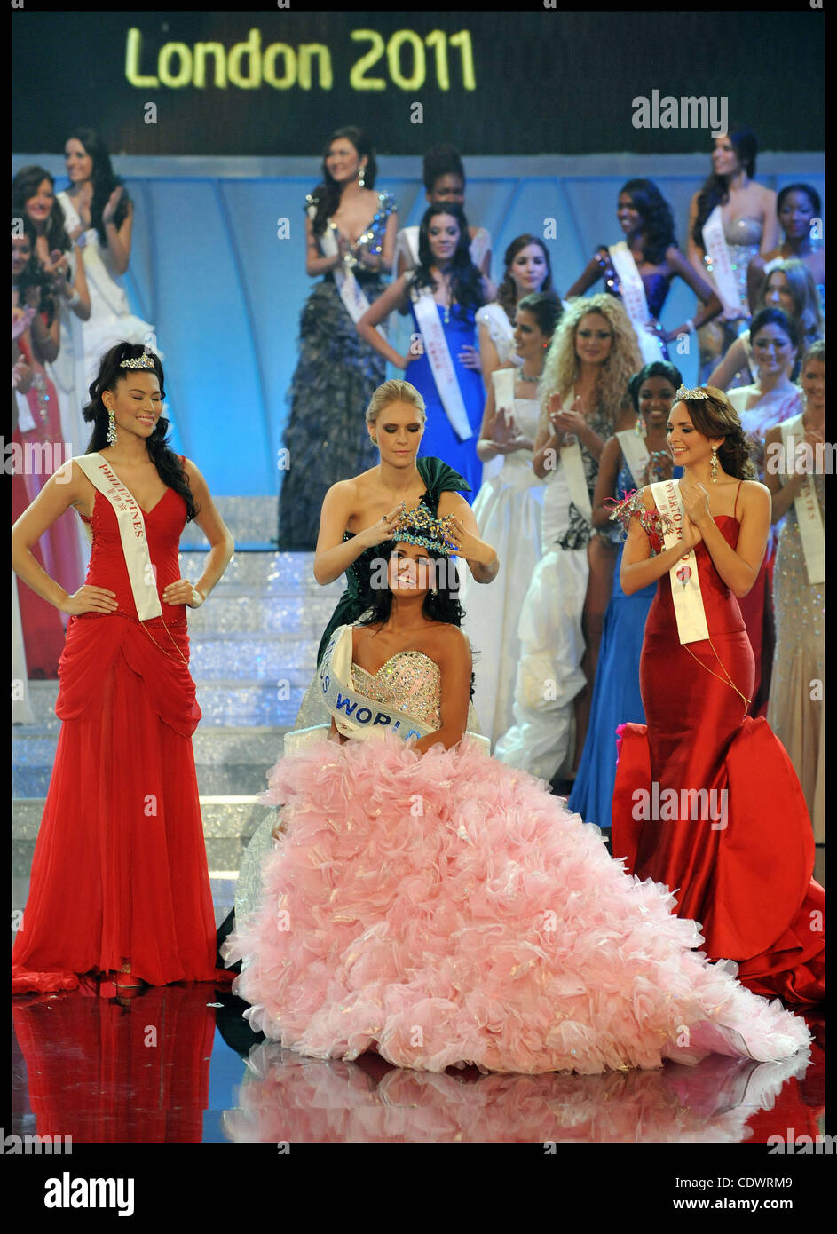 Nov. 6, 2011 - London, United Kingdom - Miss Venezuela Ivian Lunasol Sarcos Colmenares wins  the 2011 Miss World final at Earls Court London, with Gwendoline Ruais from the Philippines (left, red dress) and 3rd place Amanda Perez from Puerto Rico (right red dress), Sunday November 6, 2011. Photo By  Stock Photo