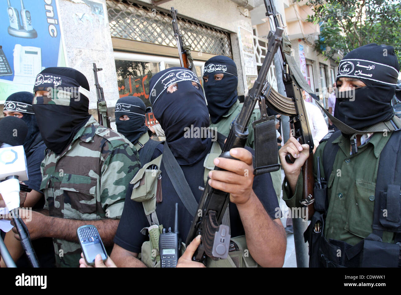 Aug. 22, 2011 - Gaza City, Gaza Strip - Palestinian militants of the Nasser Salah al-Din Brigades the military wing of the Popular Resistance Committees take part in a press conference in Gaza City to announce a temporary halt of rocket fire at Israel. One official who was involved in mediating talk Stock Photo