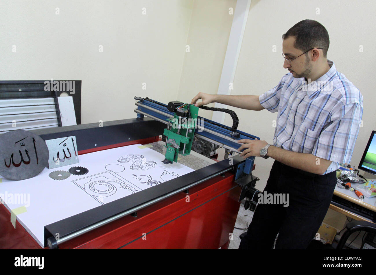 A Palestinian engineering collage student works on hand-made machine at the Islamic University in Gaza city on Sep. 20,2011.l. Photo by Mohammed Asad Stock Photo