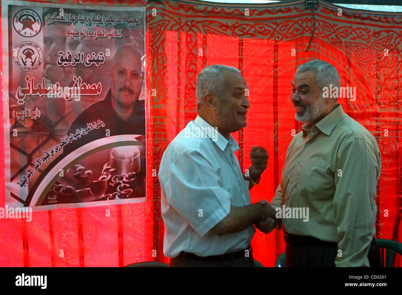 Oct. 19, 2011 - Gaza City, Gaza Strip, Palestinian Territory - Palestinian prime minister in Gaza Strip, Ismail Haniya visits the tent erected to welcome Palestinian prisoners released in exchange for the captured Israeli soldier Gilad Schalit in Gaza City, Wednesday, Oct. 19, 2011. Photo by Ashraf  Stock Photo