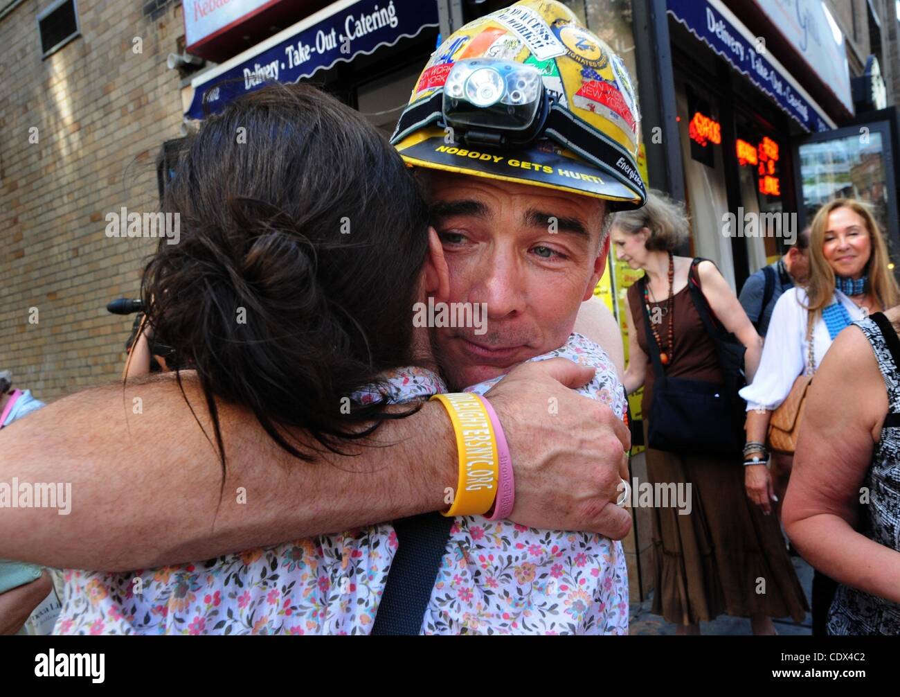 Sept. 1, 2011 Manhattan, New York, U.S. GARY RUSSO is embraced by