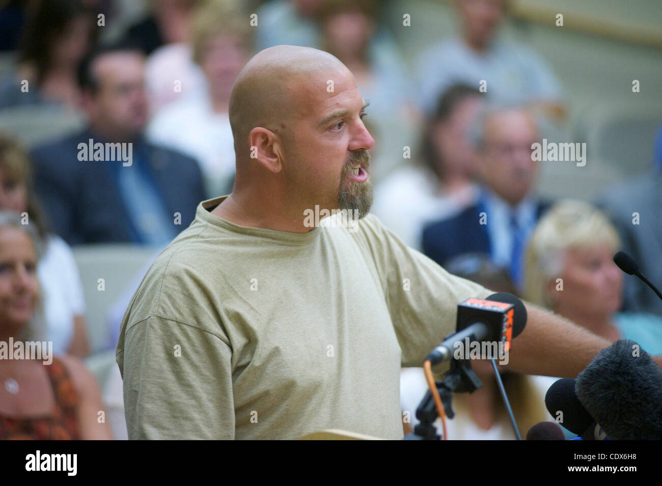 Mark Turgeon, a homeless man and witness to the arrest, speaks to the city council.  Crowds gather in protest of the Fullerton, California, Police Department and City Council followign the death of KellyTHomas, a 37-year-old homeless and mentally ill man. Thomas's July 5 arrest by six officers turne Stock Photo