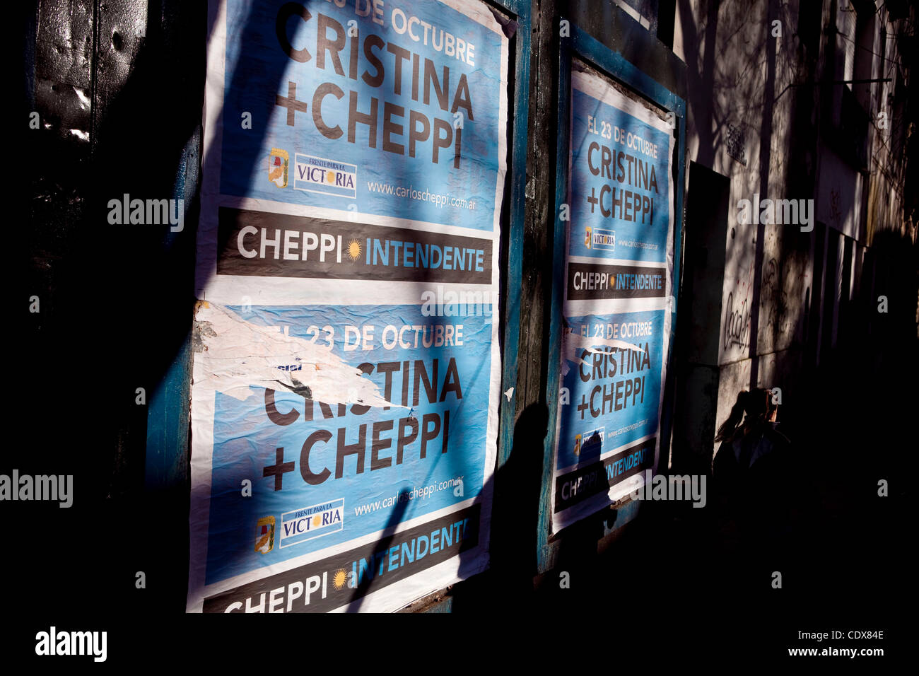 Oct 21, 2011; Mar del Plata, Buenos Aires, Argentina; A girl walks by a biilboard with Cristina Kirchner campaign posters. The political partys are wrapping up their campaigns ahead of Sunday's vote, with Kirchner considered a foregone conclusion to win. (Credit Image © Ryan Noble/ZUMA Press) Stock Photo