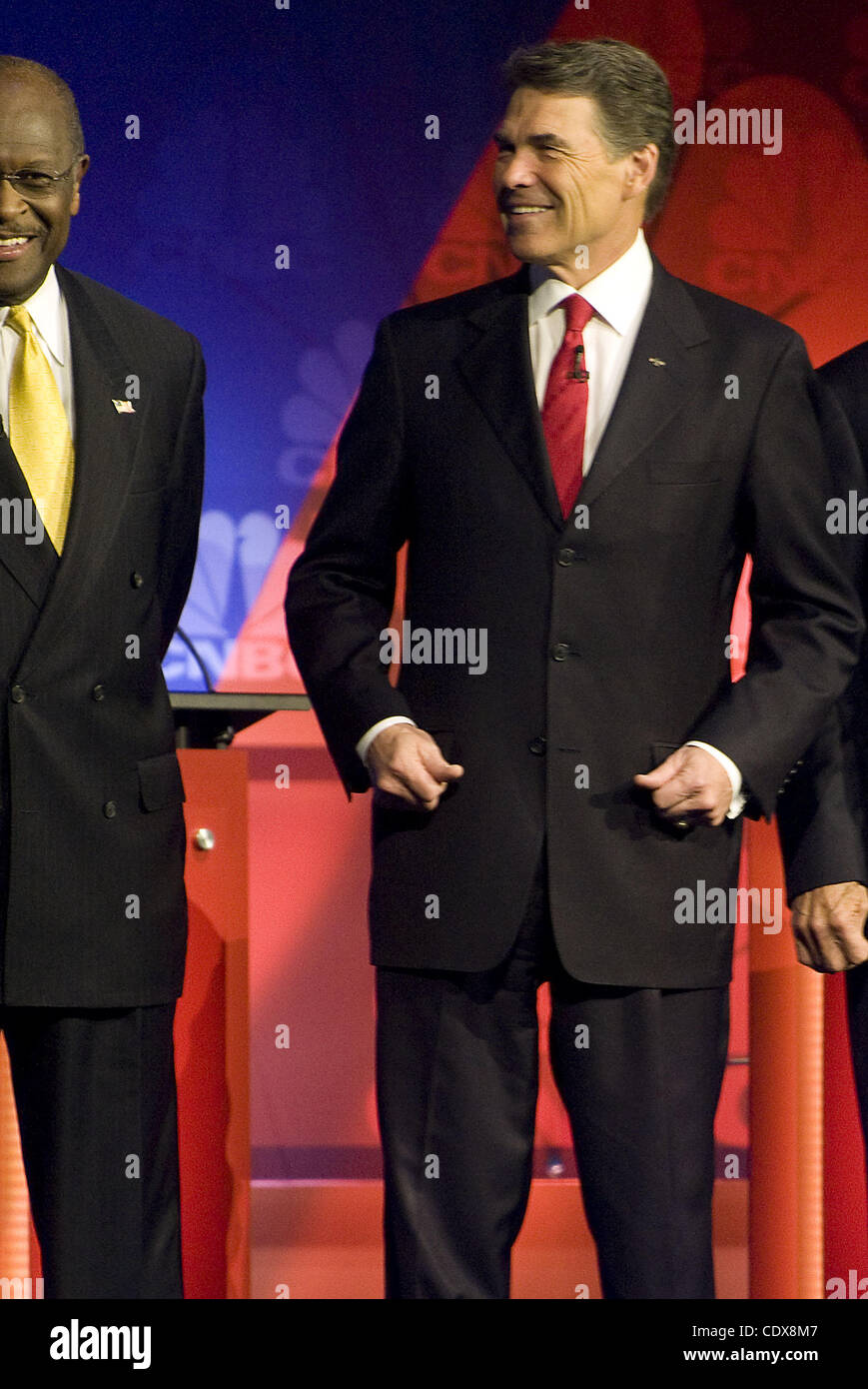 Nov. 9, 2011 - Rochester, Michigan, U.S - RICK PERRY, right,  stands next to Herman Cain, as they line up at the start of a republican presidential debate hosted by CNBC at Oakland University. Rick Perry suffered a gaffe at the GOP debate in Detroit Wednesday when he couldn't remember one of the thr Stock Photo