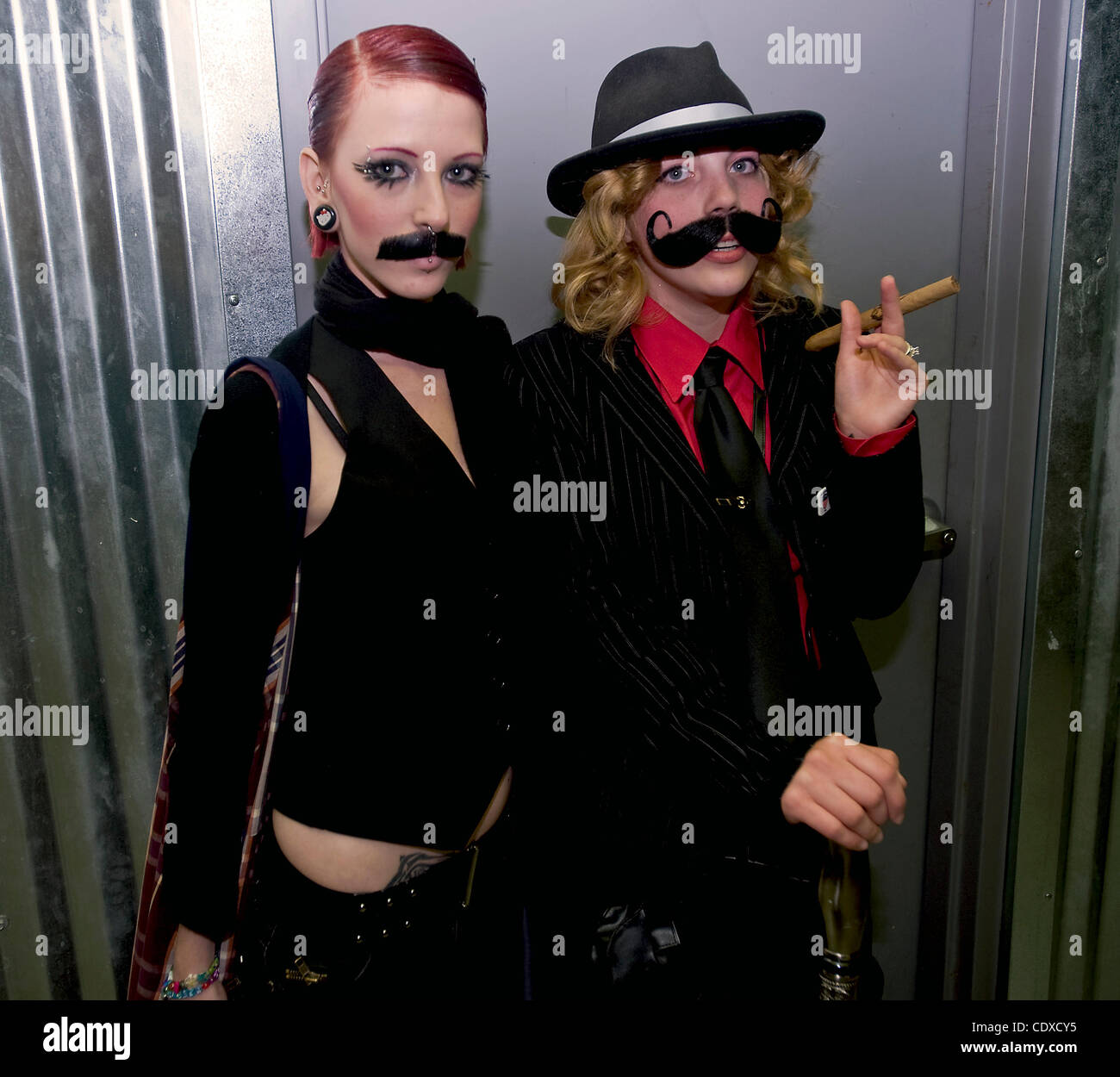 Oct. 7, 2011 - Lancaster, Pennsylvania, U.S. - KELLY HOLT (L) and SAVANNAH FLANSBURG, contestants in the Whiskerinas National Ladies Fake Beard and Moustache Competition pose backstage at the Chameleon Club. (Credit Image: © Brian Cahn/ZUMAPRESS.com) Stock Photo