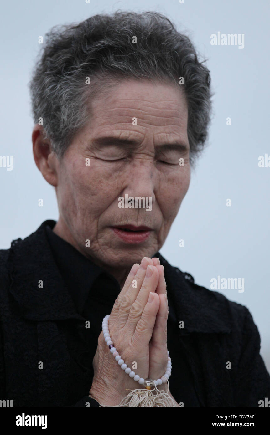Aug. 6, 2011 - Hiroshima, Japan - Woman prays for the victims of the atomic bomb in the Peace Memorial Park in the peace memorial park in Hiroshima, Japan. Japan marks the 66th anniversary of the world's first atomic bomb. (Credit Image: © Junko Kimura/Jana Press/ZUMAPRESS.com) Stock Photo