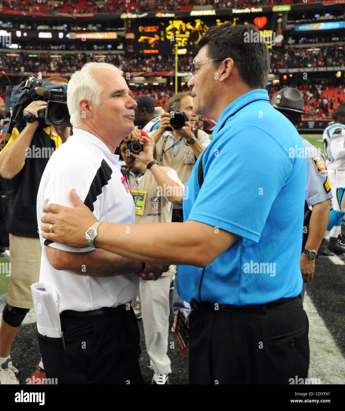 Oct. 16, 2011 - Atlanta, GA, U.S. - Atlanta Falcons head coach Mike Smith, left, greets Carolina Panthers head coach Ron Rivers after an NFL football game at the Georgia Dome in Atlanta, Georgia on October 16, 2011. The Falcons defeated the Panthers 31-17.  UPI Photo/Erik S. Lesser (Credit Image: ©  Stock Photo