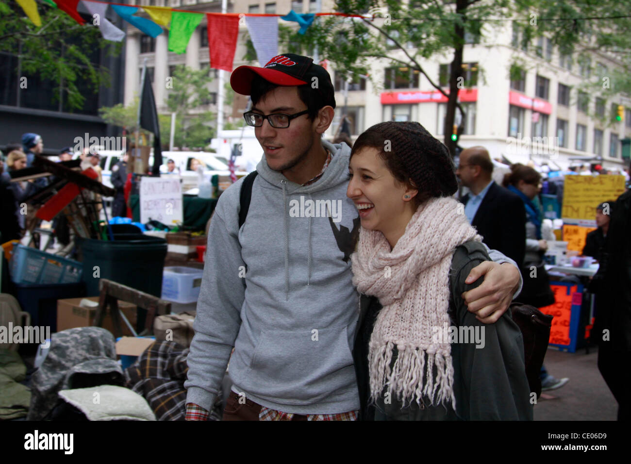 A young couple at the Occupy Wall Street protest in Zuccotti Park. Some call it a shanty town and a circus. Others call it a political and social revolution. Stock Photo