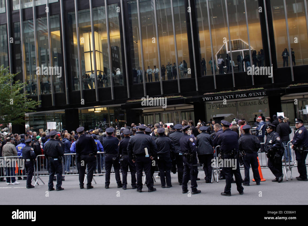 Occupy Wall Street activists march on Park Avenue to the headquarters ...