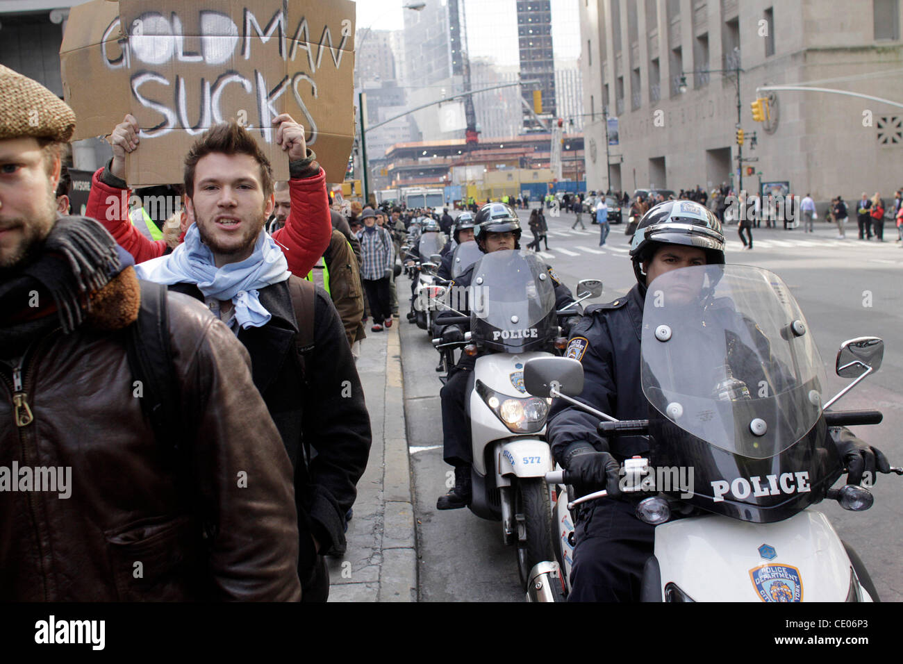 Occupy Wall Street protesters march to the offices of the massive financial firm Goldman Sachs who they say should be put on trial for fraud and corruption related to housing foreclosures, pension losses, and student debt. Stock Photo