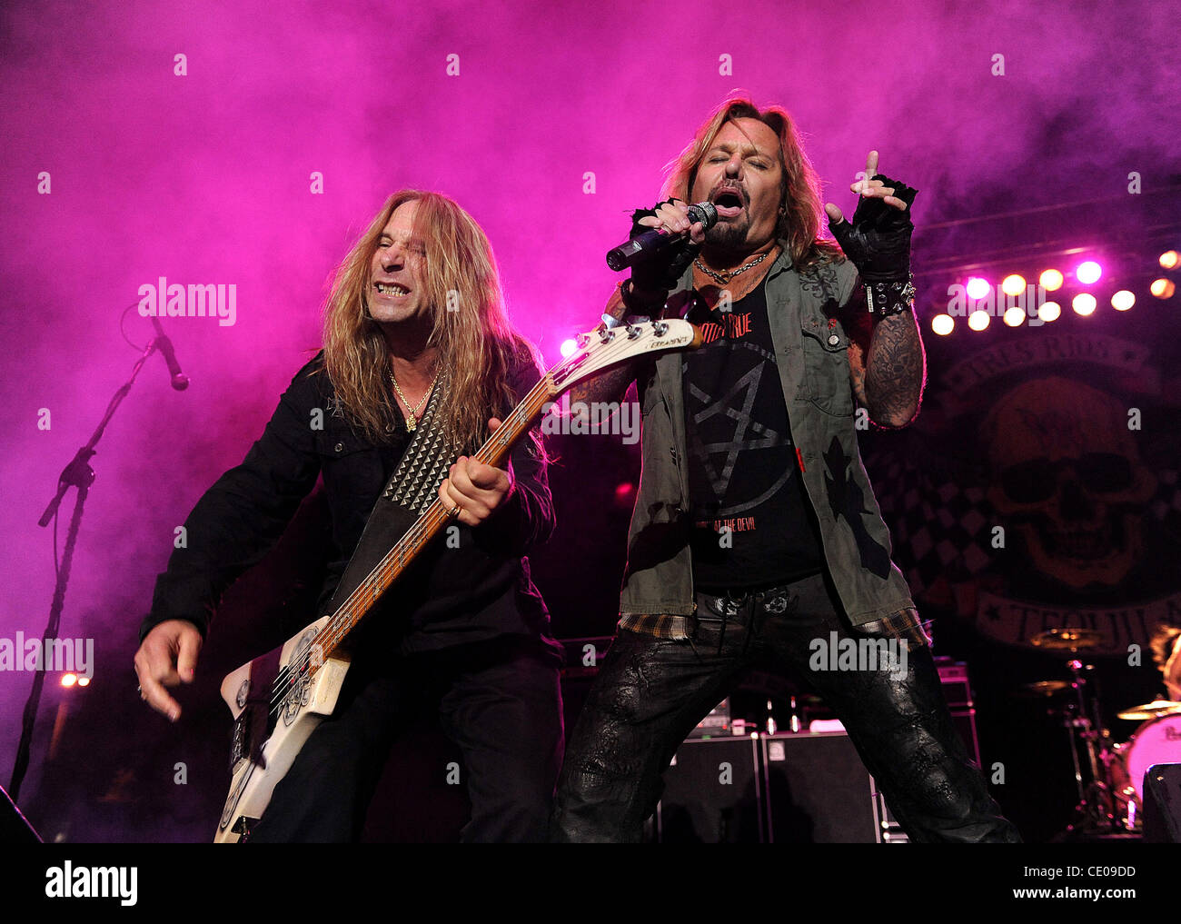 Oct 22, 2011 - Raleigh, North Carolina; USA - (R-L) Singer VINCE NEIL and Bass Guitarist DANA STRUM of the band Slaughter performs as Vince Neil's 2011 Solo Tour makes of stop at the Raleigh Amphitheatre.  Copyright 2011 Jason Moore. (Credit Image: © Jason Moore/ZUMAPRESS.com) Stock Photo