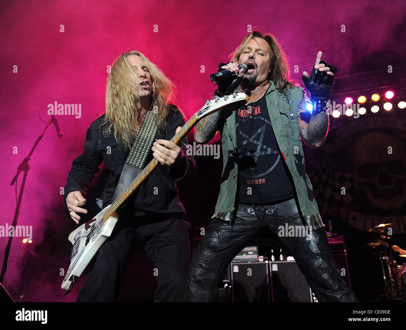 Oct 22, 2011 - Raleigh, North Carolina; USA - (R-L) Singer VINCE NEIL and Bass Guitarist DANA STRUM of the band Slaughter performs as Vince Neil's 2011 Solo Tour makes of stop at the Raleigh Amphitheatre.  Copyright 2011 Jason Moore. (Credit Image: © Jason Moore/ZUMAPRESS.com) Stock Photo