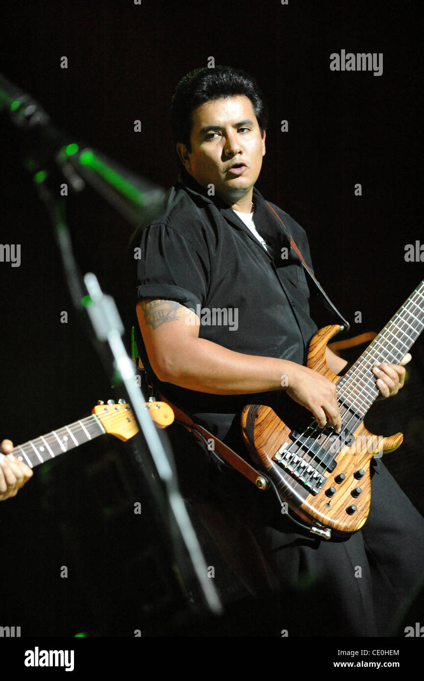 JoJo, bass guitar player for the Grammy Award winning Rock-N-Roll trio Los  Lonely Boys, grimaces as he plays during a music concert featuring the  Texas based band, at Contingency Operating Base Speicher