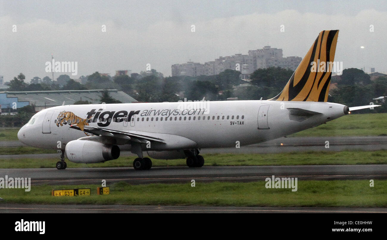 MANILA --An aircraft of Singapore's Tiger aireways is seen at the runway of  Ninoy Aquino International Airport in Manila, Philippines on Friday, August 19, 2011. Stock Photo