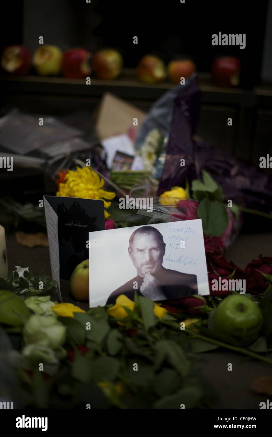 Oct. 6, 2011 - Manchester, England, UK - A memorial for visionary Apple CEO and co-founder STEVE JOBS is created outside the London Regent Street Apple store. (Credit Image: © Mark Makela/ZUMAPRESS.com) Stock Photo
