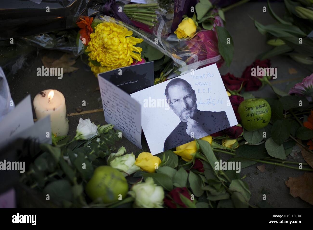 Oct. 6, 2011 - Manchester, England, UK - A memorial for visionary Apple CEO and co-founder STEVE JOBS is created outside the London Regent Street Apple store. (Credit Image: © Mark Makela/ZUMAPRESS.com) Stock Photo