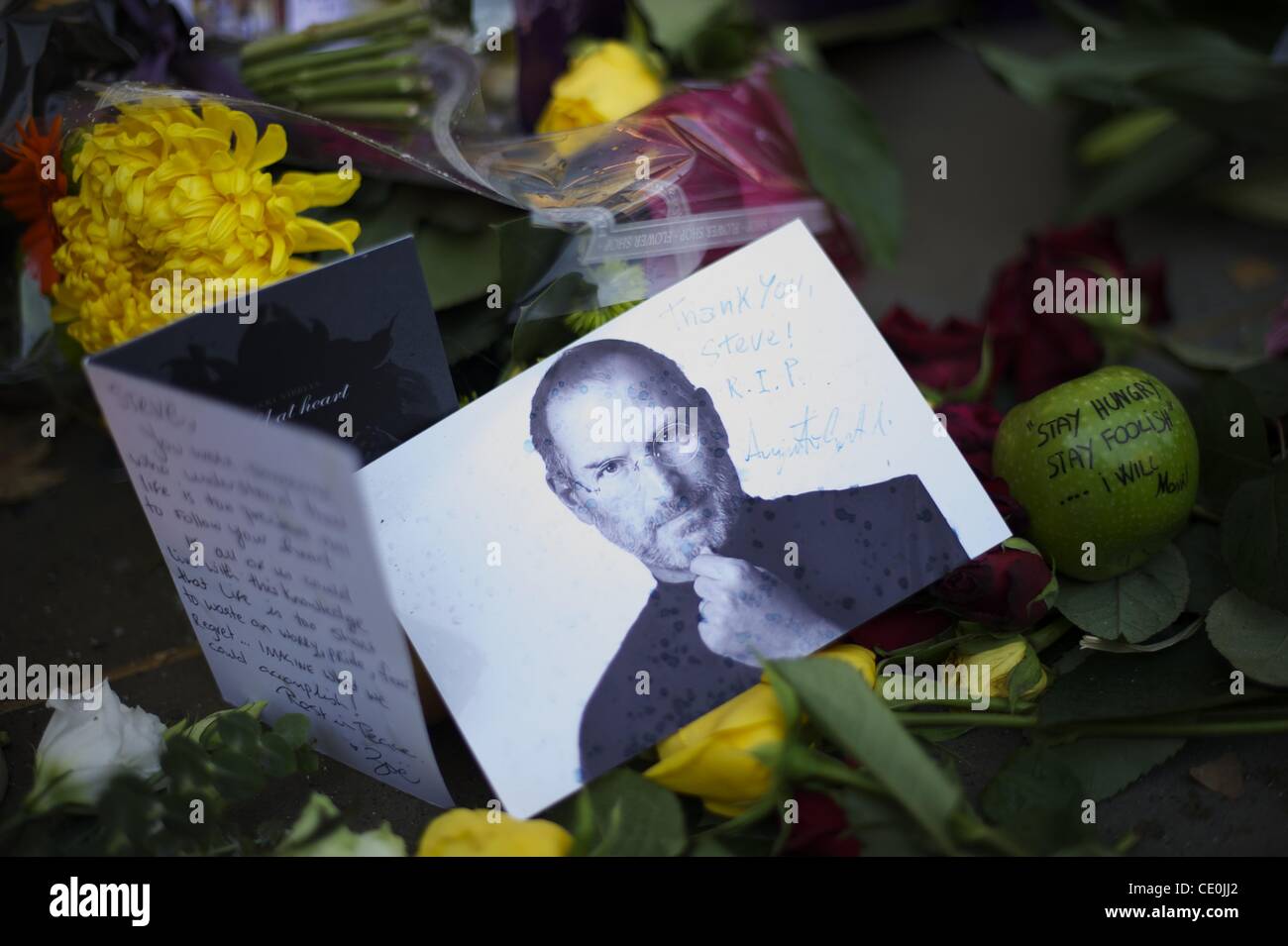Oct. 6, 2011 - Manchester, England, UK - A memorial for visionary Apple CEO and co-founder STEVE JOBS is created outside the London Regent Street Apple store. (Credit Image: © Mark Makela/ZUMAPRESS.com) Stock Photo