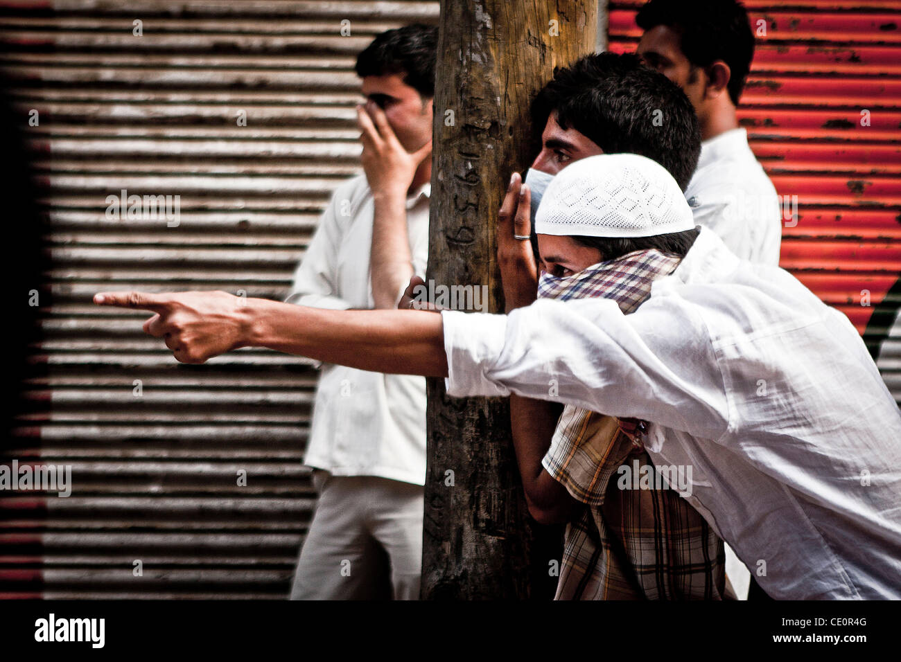 Kashmiri muslim stone pelters during a street protest with the paramilitary indian force and police in downtown of Srinagar. Protest was held in Nowhatta area by stone-throwing youths against Indian's rule in disputed territory of Kashmir, where anti-India sentiment runs deep among the majority musl Stock Photo