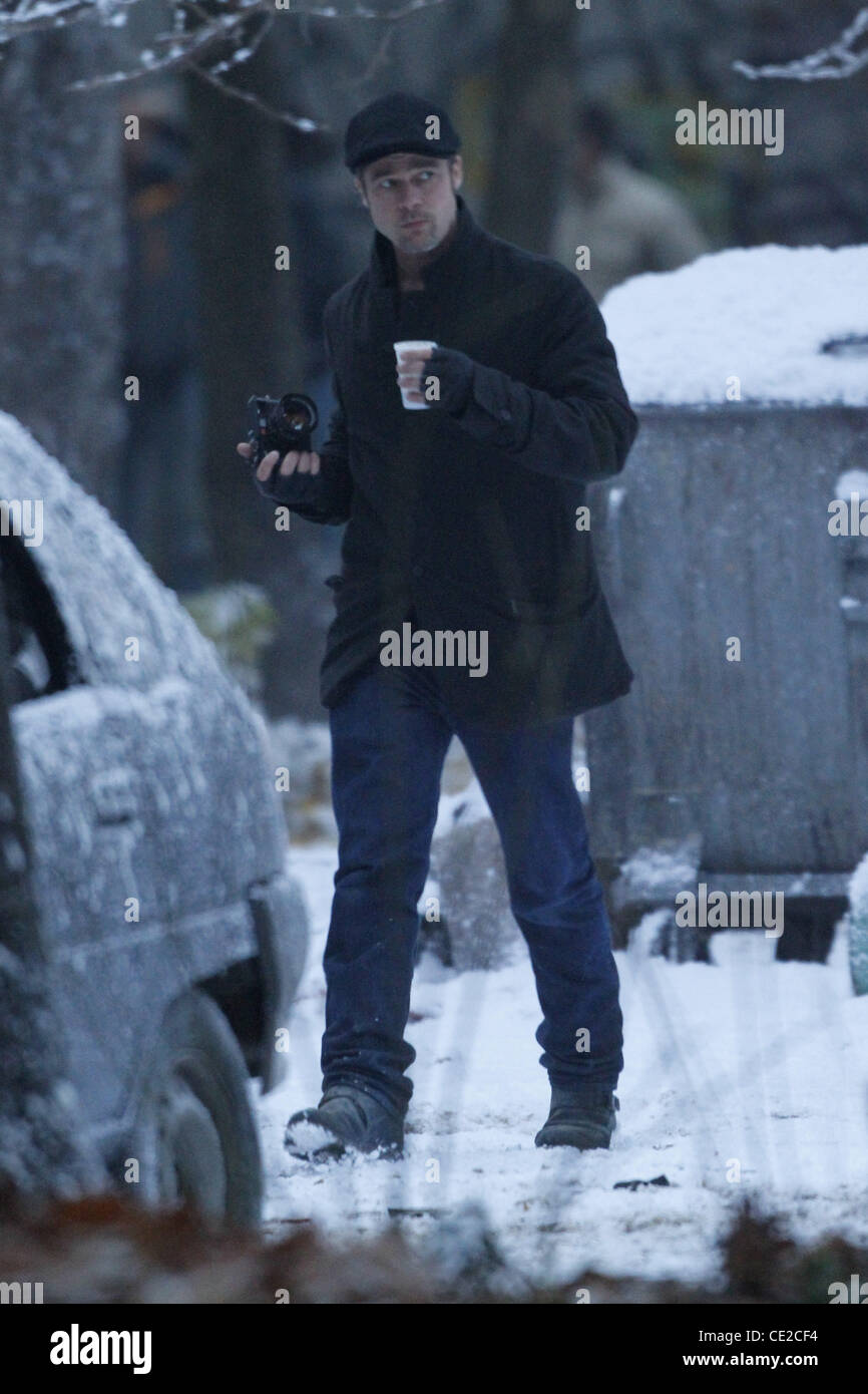 Brad Pitt drinking a cup of coffee on the set of Angelina Jolie's