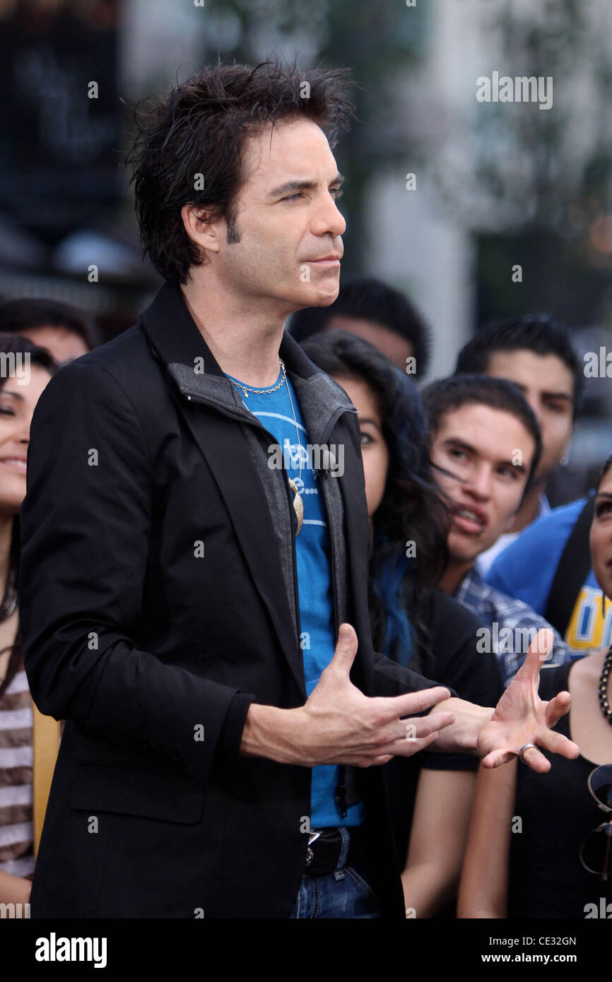 Train lead singer Pat Monahan films an interview for the entertainment television news programme