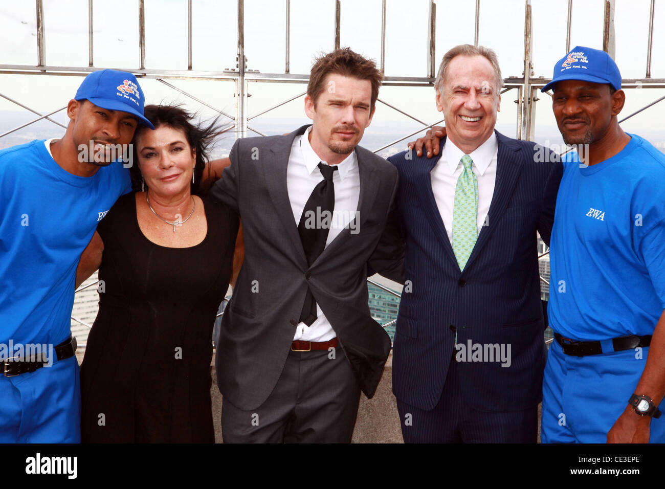 Abner Palmer, Harriet McDonald, Ethan Hawke, George McDonald, David Booker  Ethan Hawke lights the Empire State Building blue to celebrate the 'Men in Blue' of the Doe Fund's Ready, Willing and Able Program New York City, USA - 28.10.10 Stock Photo