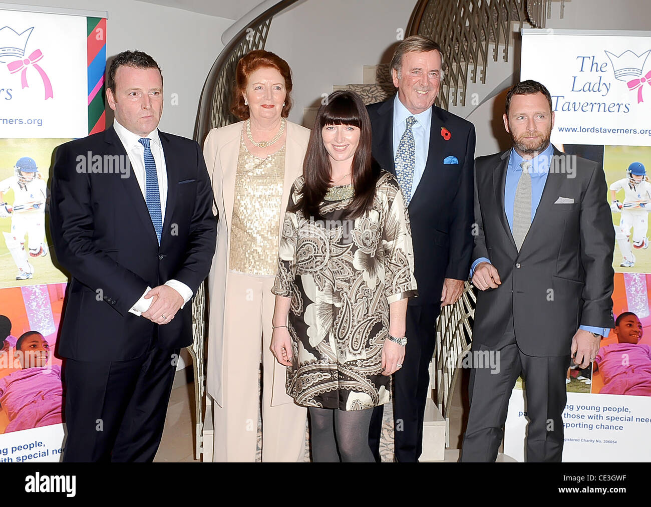 Sir Terry Wogan and his wife Lady Helen Wogan with their sons Alan (L) and Mark (R) and daughter Kathertine (C)  Sir Terry Wogan attends a tribute lunch in his honour, held at the Dorchester Hotel London, England - 05.11.10 Stock Photo